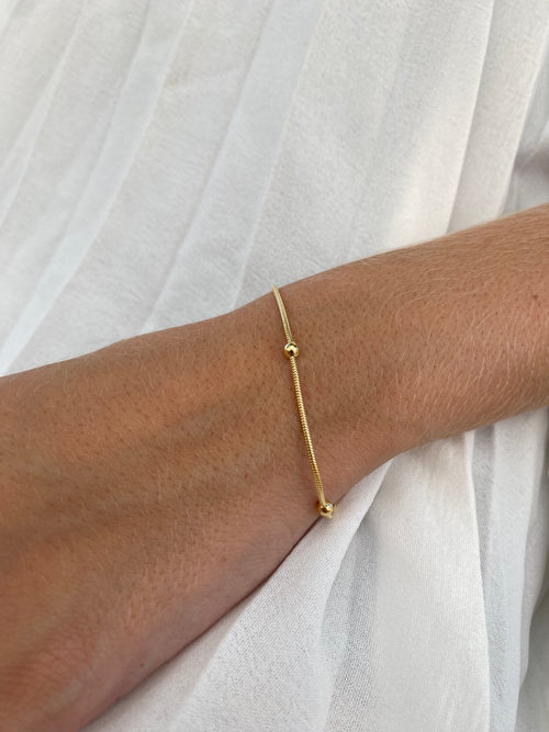 Pulseira Lisa Bolinha Banhada a Ouro 18K