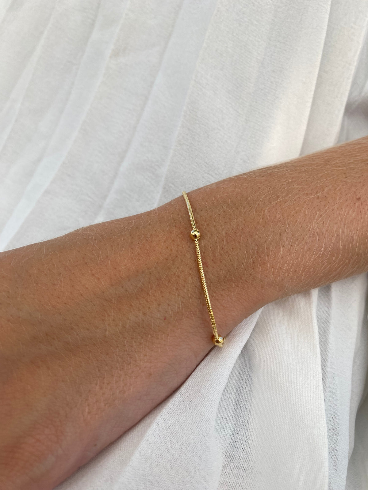 Pulseira Lisa Bolinha Banhada a Ouro 18K